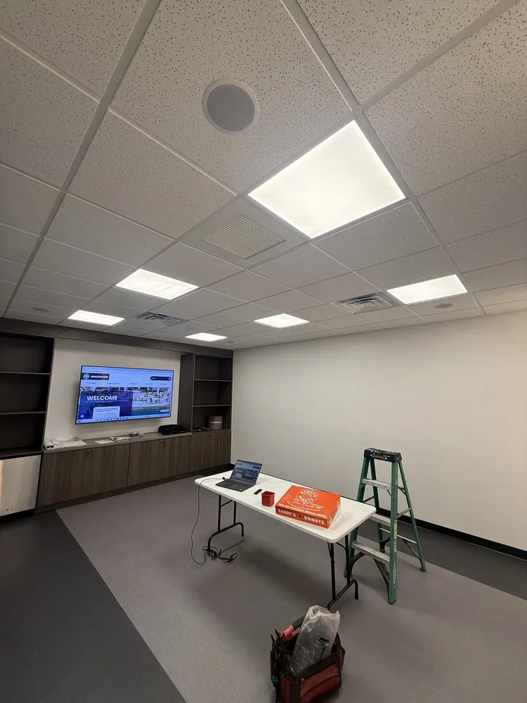 Empty office with new flat LED panels in the drop ceiling.
